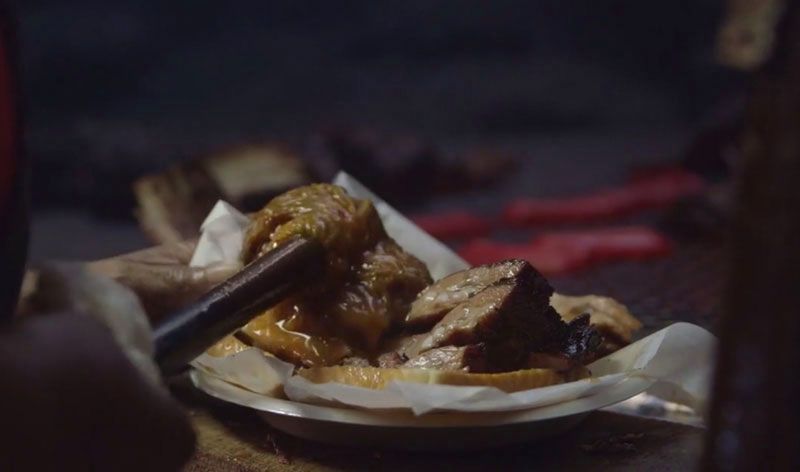 Plate of pork ribs being served at Archibald's pit